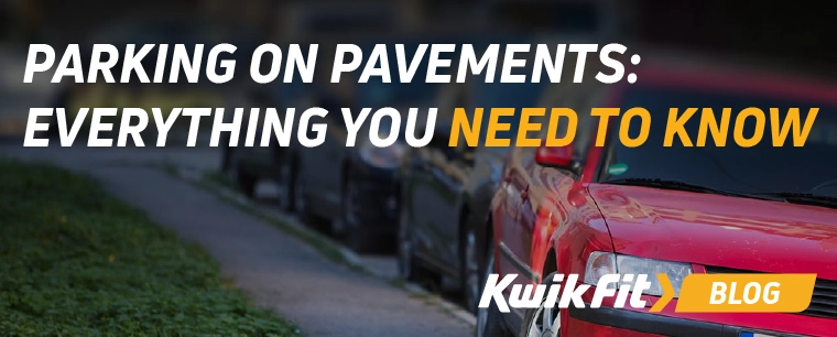 A row of cars parked up, with one of them on the pavement.